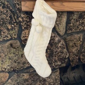 Cable knit stocking with poms